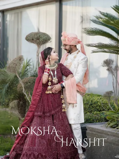 A beautiful outdoor portrait of the couple. The bride's gaze towards the groom and the lush greenery create a romantic and serene wedding photograph.
