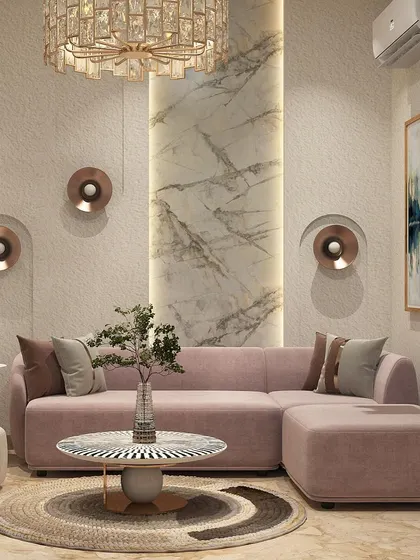 We designed this lounge with a soft, dusty pink L-shaped sofa as the centerpiece. The space is elevated by a marble accent pillar, unique copper wall sconces, and a striking black and white inlay coffee table.