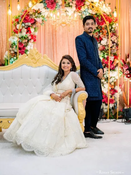 A beautiful reception moment. This couple rented their outfits from me, and they look perfectly coordinated and so happy. The bride's white sequin lehenga is a stunner.