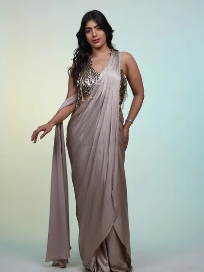 Another pose in the metallic saree, highlighting the way the fabric shimmers and flows. This is a perfect example of renting a high-impact, low-effort look.