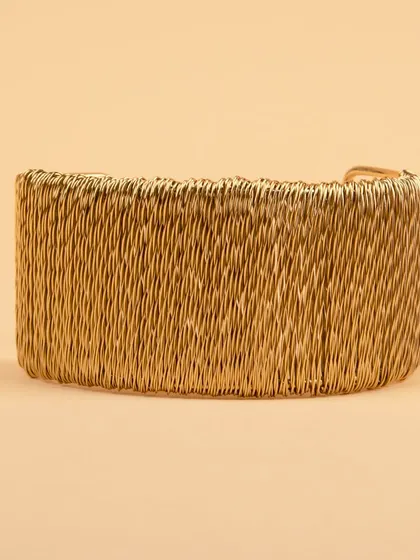 The woven gold cuff bracelet from a different angle.