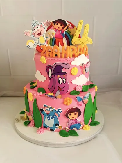 A full view of this fun Dora-themed cake, complete with characters like Boots and Backpack.