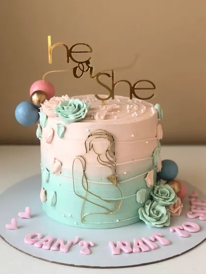 "He or She, Can't Wait to See!" A lovely gender reveal cake with a pink and blue ombre design and a modern line-art topper.