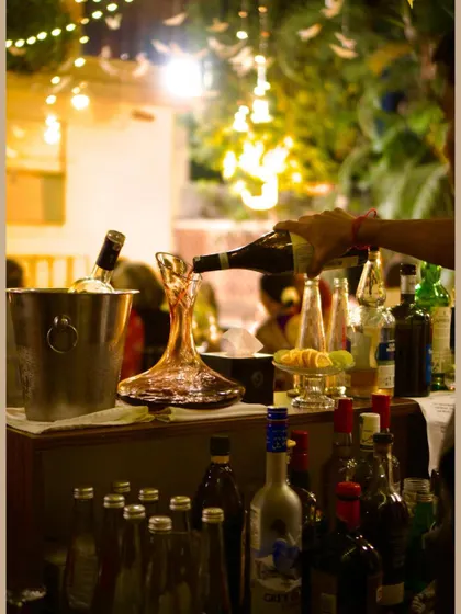 The bar at the 'Red Lilies, Water Birds' saree exhibition. I love decanting wine and setting up a bar that feels both elegant and inviting.