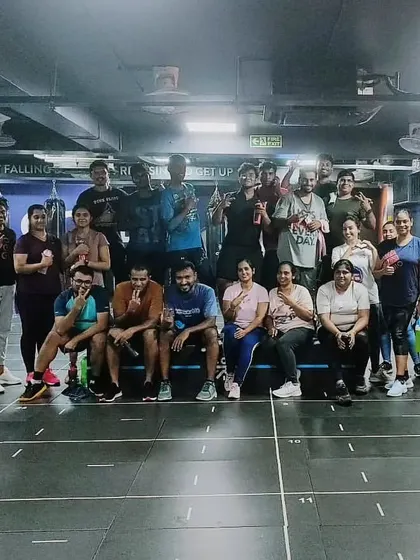 The heart and soul of my classes. Each photo captures a unique moment with my incredible community after a sweaty, joyful session. This is our shared victory lap.