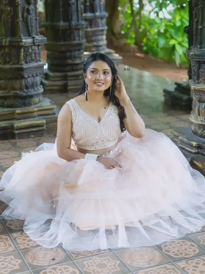 A beautiful portrait from a collaborative photoshoot. The model is wearing one of my peach-pink tulle lehengas, a soft and romantic piece.