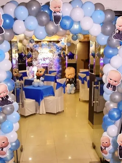 A grand entrance arch for a Boss Baby party, decorated with character stickers.