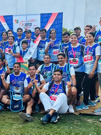 The whole group celebrating after the Kanpur Heritage Run. It's a great example of community and shared accomplishment.