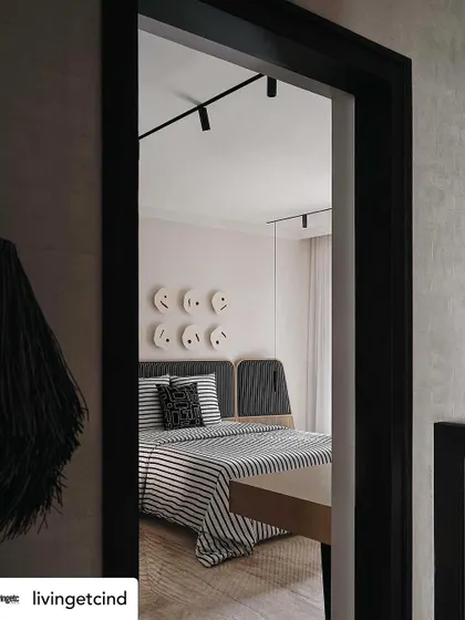 A peek into the monochromatic guest bedroom, as featured in Livingetc. The design is clean, modern, and inviting.