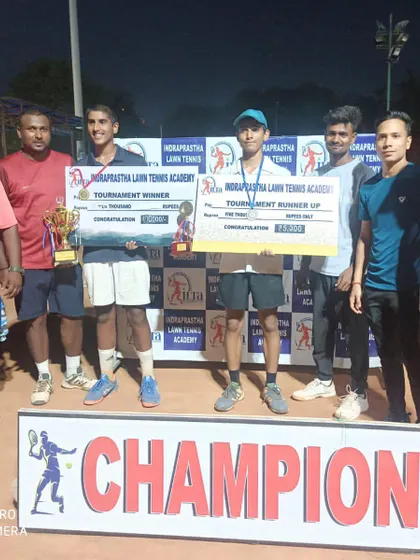 The finalists and coaching staff at our prize money tournament. Hosting these events is part of our commitment to developing the local tennis community.