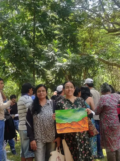 Posing with a fellow artist and her beautiful mountain landscape painting.