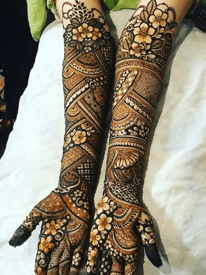 A full-arm floral design. The winding vines and blooming flowers create a very organic and feminine look.