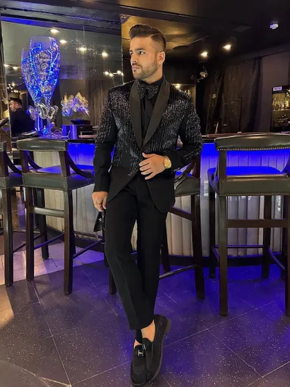 The perfect bar-side look. Our client wears his sequin tuxedo in a stylish, modern setting.
