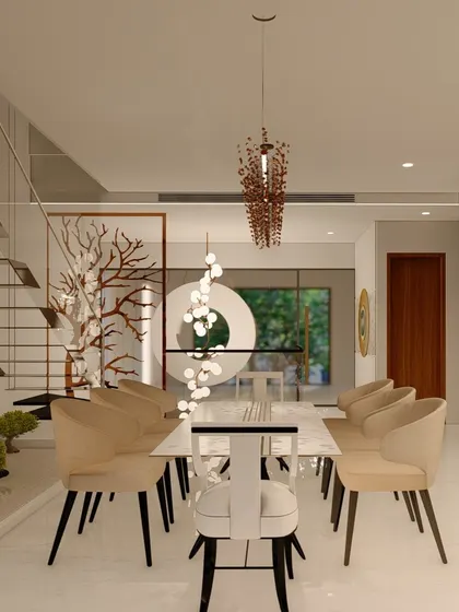 This dining space is defined by sculptural lighting and a view into a small zen garden under the staircase. We use artistic elements to elevate everyday spaces and create a unique atmosphere.