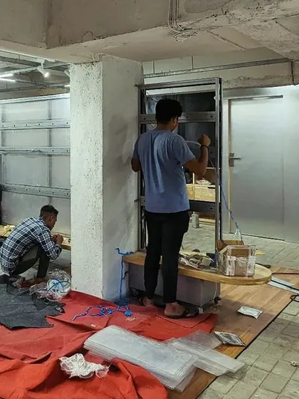 The layout of Capsul is organized around a central fixture, creating "street pockets" and "alleyways" for customers to explore. We retained elements of the former bank, like the exposed re-bars from the strong room, to create unique nooks and trial rooms that honor the building's history.