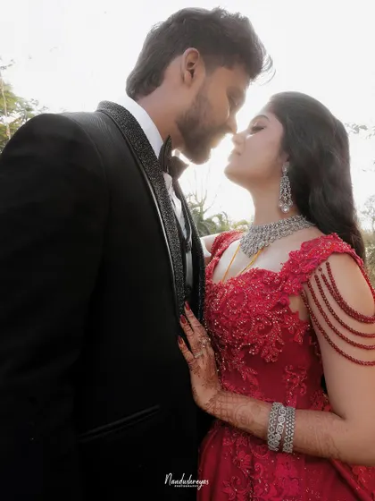 A close-up, intimate portrait of the couple. The focus is on their connection and the sophisticated details of their reception look.
