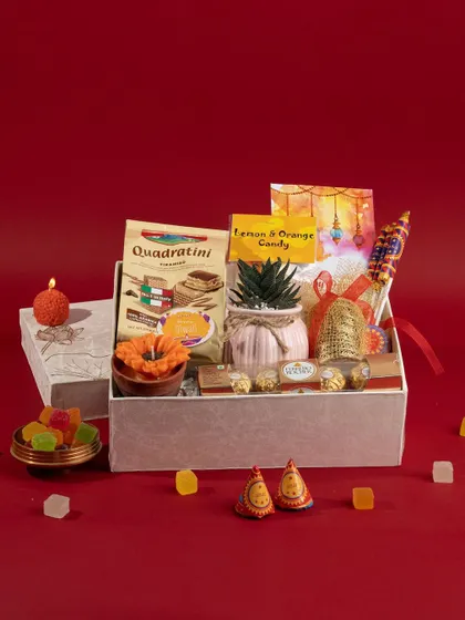 A beautifully arranged Diwali gift box, combining traditional sweets and decor with modern treats for a perfect festive gift.