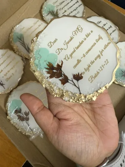 These 8 pretty thank you giveaways were for students of Ramaiah College to give to their professors. Each coaster has a thoughtful quote and is decorated with preserved flowers and a gold edge.
