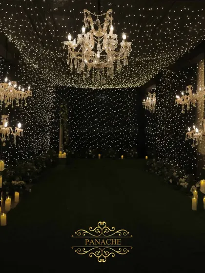 Inside the fairy light tunnel, we placed elegant crystal chandeliers to add a touch of classic glamour to the magical, starry ambiance.