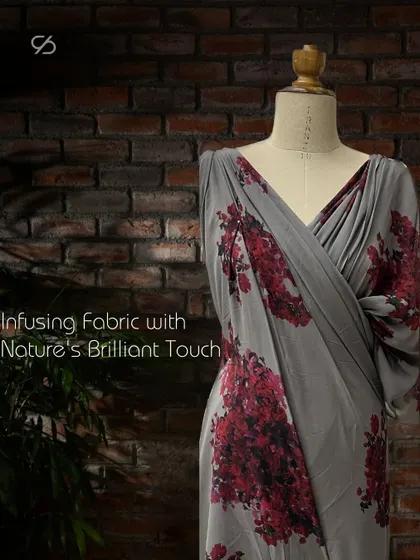 Infusing fabric with nature's brilliant touch. This grey satin fabric features a beautiful bougainvillea print, ready to be draped into an elegant garment.
