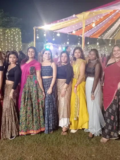 The full group of performers in their beautiful, varied ethnic wear for an outdoor event. We choreograph for groups of all sizes.