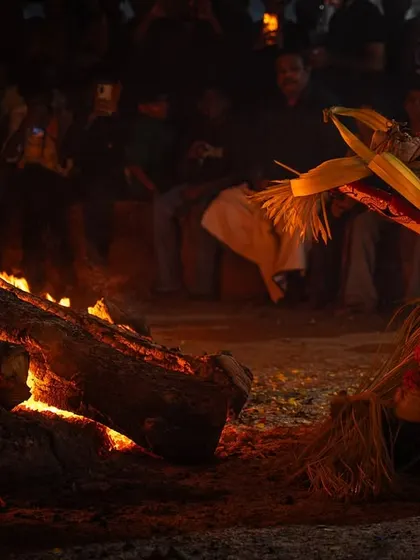 A series capturing the different stages of the Pottan Theyyam ritual, from the performer lying on the embers to being tended to by assistants. These images show the intensity and devotion involved in the all-night ceremony.