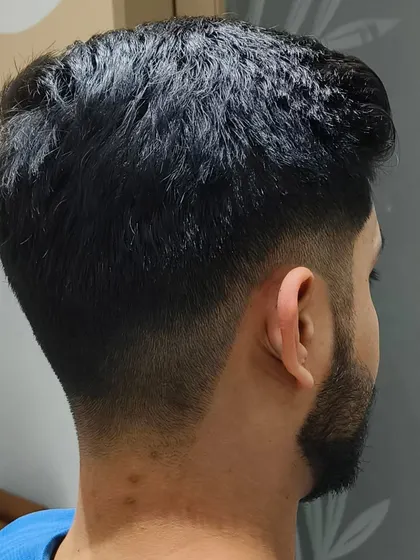 The back view of a sharp men's fade haircut.
