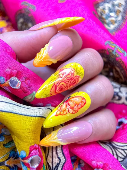 This angle highlights the unique 3D sculpted tips, which add texture and a dynamic element to the classic French manicure style.