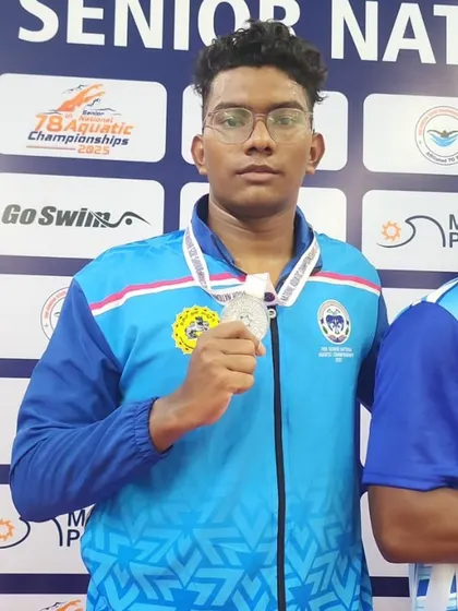 Manikanta L with his silver medal from the medley relay.