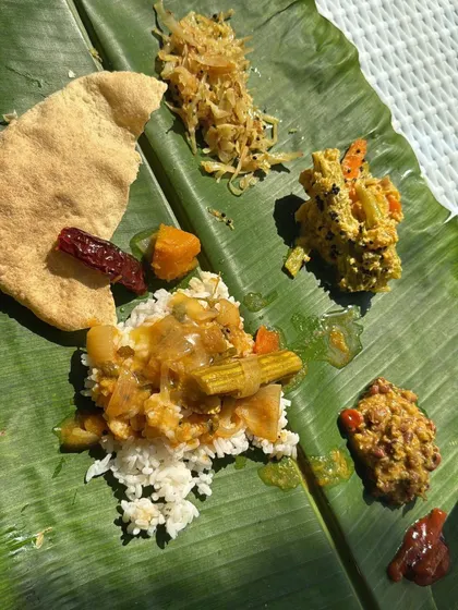 Nourishing our bodies with healthy and delicious food is key. We enjoy fresh fruit platters, wholesome granola, and local delicacies like this traditional meal served on a banana leaf.