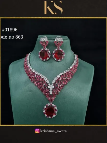 A premium American Diamond bridal set with a beautiful design and red stones.