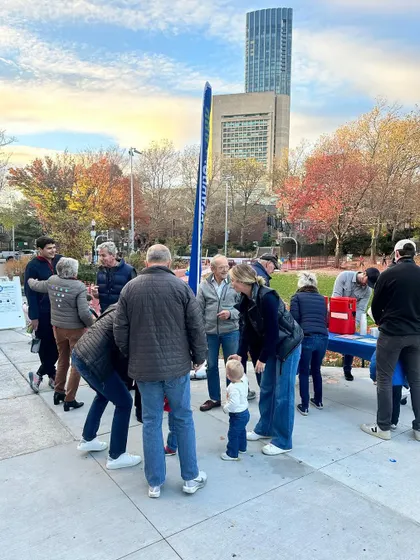 The community gathering at the park event in Boston. It was a lively atmosphere, with people of all ages coming together to enjoy the day and our live art session.