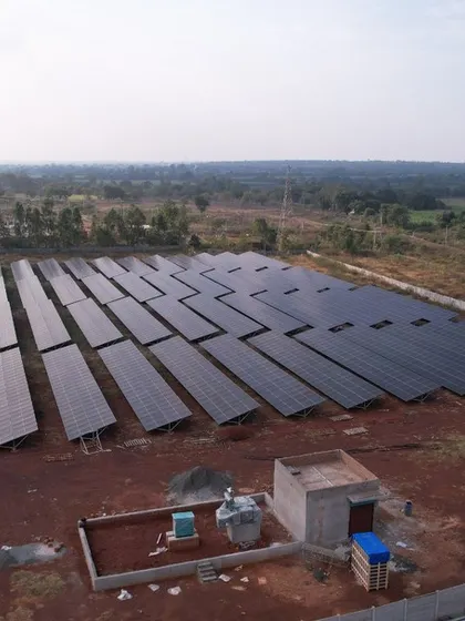 The completed 1.3 MW solar farm, featuring a dedicated control station for monitoring and managing the power output. This is a complete turnkey solution for large-scale energy generation.