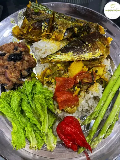 The aroma of this mackerel fish curry is enhanced by the stink bean eromba and a fresh u morok (king chilli).