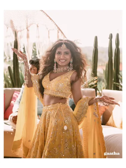Our radiant bride, full of joy and energy, at her fun-filled Haldi ceremony in Bali.