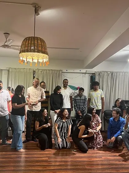 A fun, candid group photo after my 'Stories for Adults' session. It is wonderful to see a room full of grown-ups reconnecting with their inner child and the simple magic of being told a story.