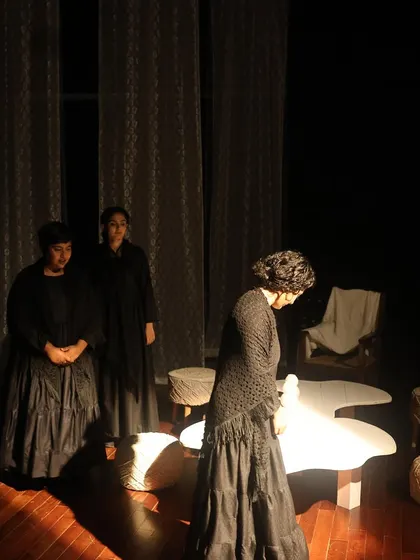 An ensemble moment from "The House of Bernarda Alba." The all-women cast powerfully portrays the complex relationships and emotional struggles within the family.