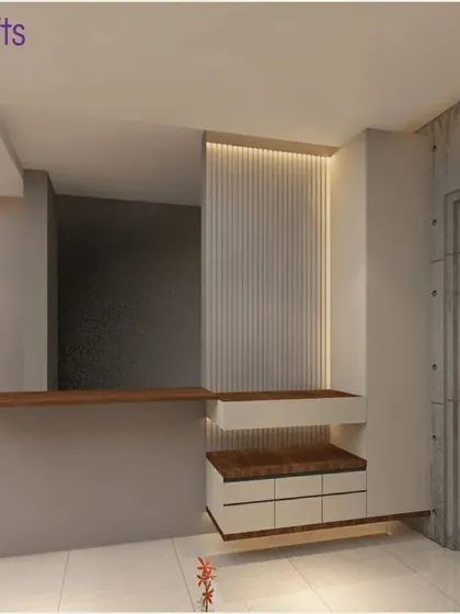 The entrance foyer of the 'Konark Splendor' home, featuring a concrete-finish door and a sleek shoe cabinet with a seating nook, setting a modern industrial tone.