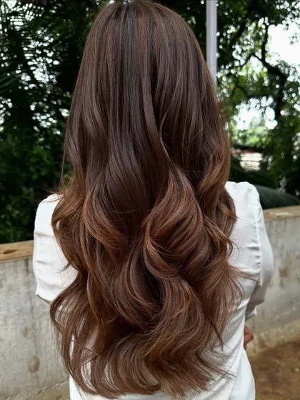 The back view of her beautiful wedding guest hair.