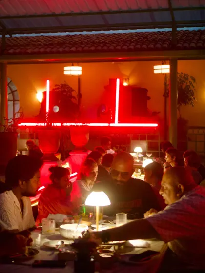 The bar deck comes alive during SWITCH, with red neon lights setting a dramatic mood for drinks and conversation.