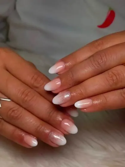 A subtle take on the ombre trend, with a hint of sparkle. This look is perfect for everyday wear, adding a touch of glamour without being overpowering.