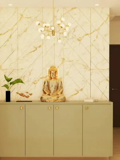 A serene and elegant entryway console in a soft sage green. The gold Buddha statue creates a peaceful focal point, set against a marble-effect wall panel with gold inlay for a touch of luxury.