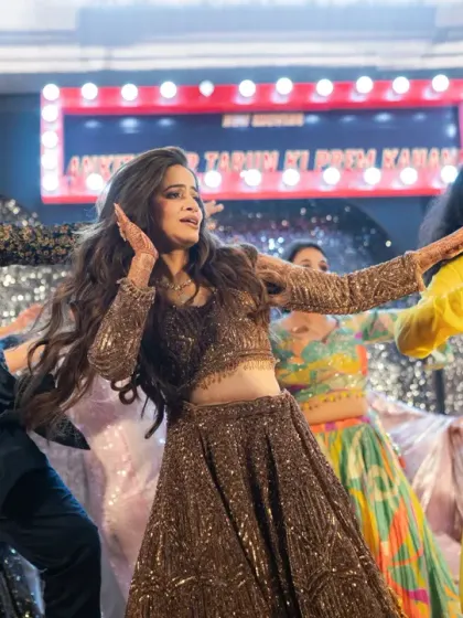 The bride and her friends owning the dance floor during a high-energy sangeet performance.