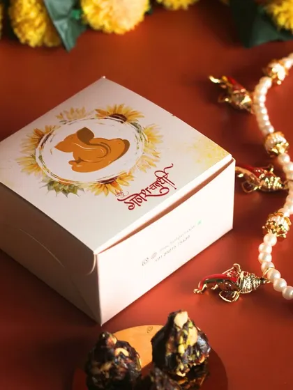 Our sugar-free and gluten-free Date and Nut Modaks come in these beautiful custom boxes, making them a perfect and divine offering for Ganesh Chaturthi.