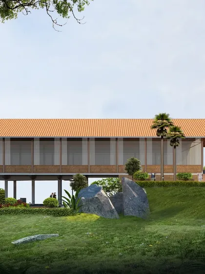 A view of the Kaivalyam reception building from below, showing how it sits lightly on the land, preserving the natural contours of the hill.