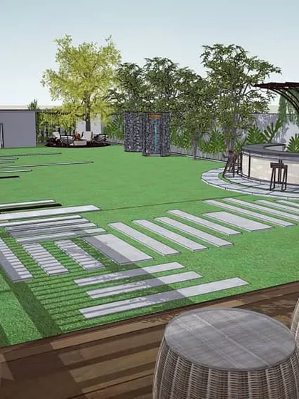 This view from the deck of Retreat Villa 90 looks out across the expansive lawn towards the outdoor bar, showcasing the open and connected feel of the landscape design.