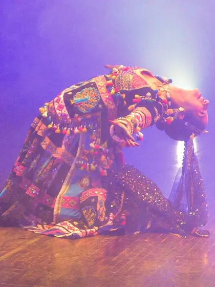 The iconic backbend of the Kalbelia dance. This is a moment of complete trust and surrender, a physical expression of the dance's deep spiritual roots.