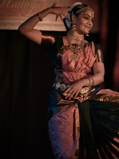 The graceful posture and movement of the dancer, a hallmark of the classical Bharatanatyam style.