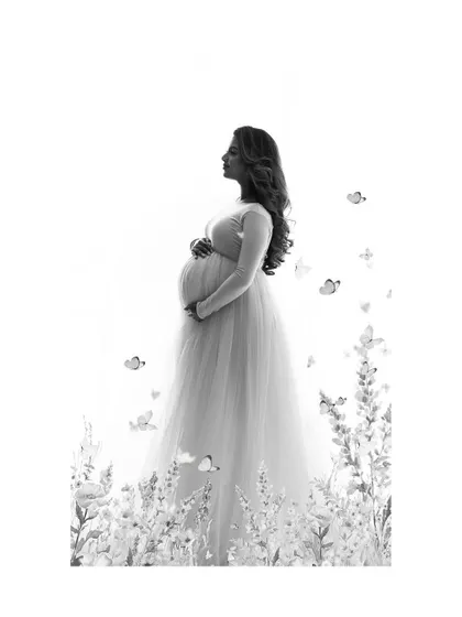 A minimalist version of the whimsical monochrome portrait. The composition gives a sense of peace and serenity, focusing on the mother-to-be in her own magical world.