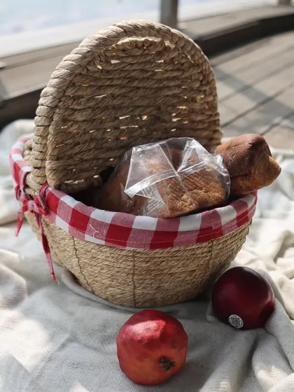 Our versatile baskets do it all, from picnic hampers to home decor. This classic picnic basket with a red gingham lining is perfect for a day out or for charming storage at home.